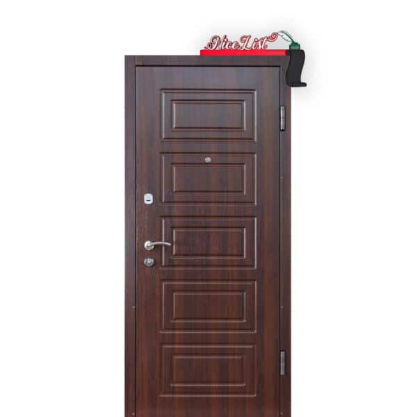 A wooden door with a silver handle and peephole is seen. Above the door is a red and white "Nice List" sign with a small black stocking hanging next to it.