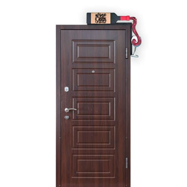 A wooden door with a panel design, featuring a silver handle and peephole. Above the door, there's a decorative wine holder shaped like a bottle opener, holding a wine bottle with the text "wine & op" visible.